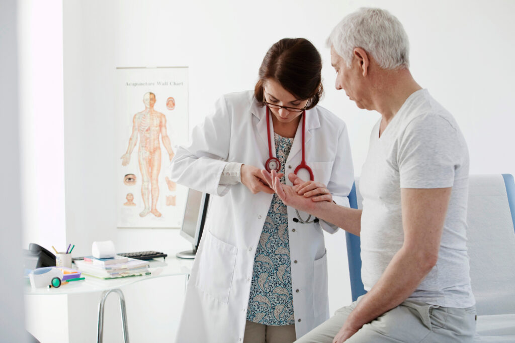 Doctor consulting with older patient in a medical office