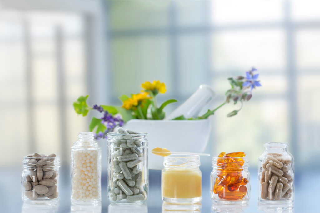 Supplements and vitamins in jars on a countertop